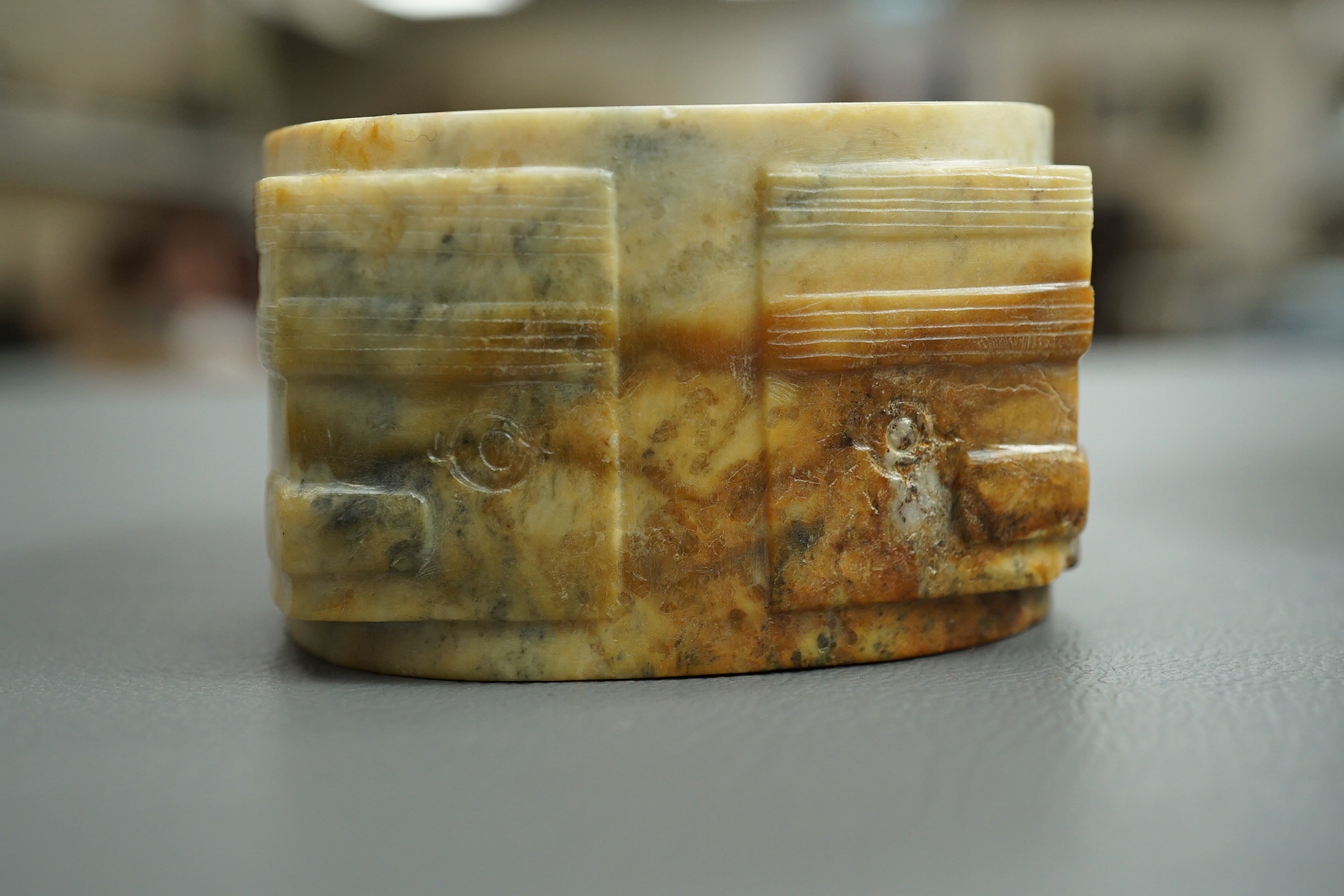 Four Chinese archaistic hardstone or burnt jade cong or cylinders